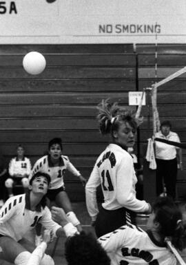 Kathy Davis and other women play during a volleyball match, St. Cloud State University