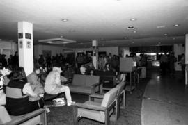 People watch a television at Atwood Memorial Center (1966) about the space shuttle Challenger explosion, St. Cloud State University