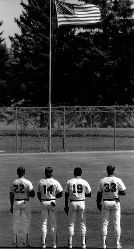 Baseball players pause during the national anthem, St. Cloud State University