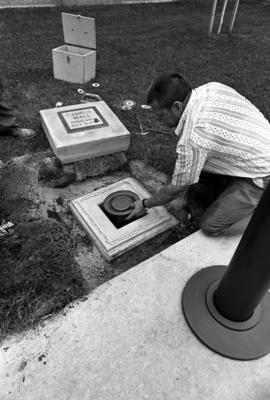 Campus mall time capsule is placed in front of Stewart Hall (1948)