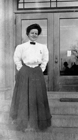Grace Machiw stands in front of Lawrence Hall (1905), St. Cloud State University