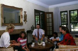 Group sits in Lewis House (1973), St. Cloud State University