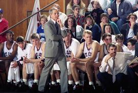 St. Cloud State basketball coach Butch Raymond stands on the sidelines in a game against Augustana College