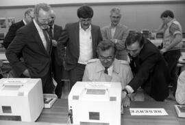 Randy Kolb, Stephen Weber, Brendan McDonald, and Jim Pehler look on as Minnesota governor Rudy Perpich uses a computer, St. Cloud State University