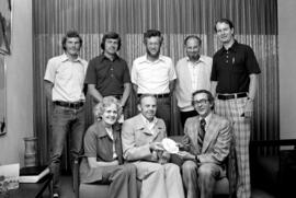 Group with Denmark commemorative plate, St. Cloud State University
