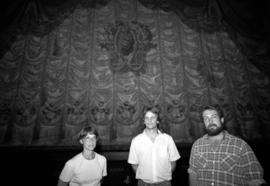 Brian Martinson and members of the New Tradition Theatre Company stand in front of the Paramount Theatre's curtain, Paramount Theatre