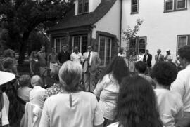 President Robert Bess speaks at Brady Watts tree dedication near the Lewis House (1973), St. Cloud State University