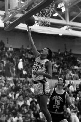 Ron Stern shoots the basketball against the backboard in a game against Southwest State University