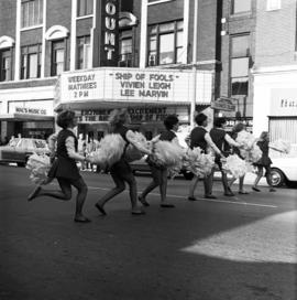 Cheerleaders at homecoming parade, St. Cloud State University