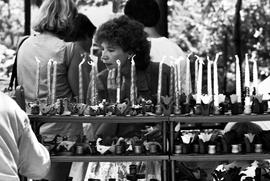 A woman looks at candles, Lemonade Concert and Art Fair, St. Cloud State University