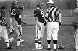 St. Cloud State football players line up in a football game against Southwest State University