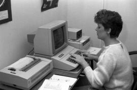 Woman uses an Apple II computer, St. Cloud State University
