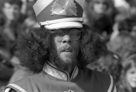 Marching band member at a football game, St. Cloud State University