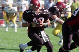 Keith Heckendorf plays quarterback during a football game against Augustana College, St. Cloud State University