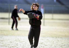 Softball player Mary Libbesmeier warms up during a softball game, St. Cloud State University