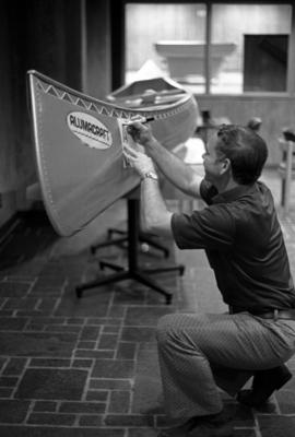 Darrell Holubetz works on a canoe, St. Cloud State University