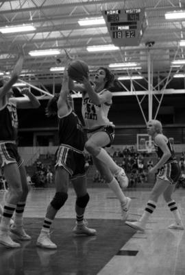 St. Cloud State University basketball player Dan Hagen jumps with the basketball during a game against Bemidji State University