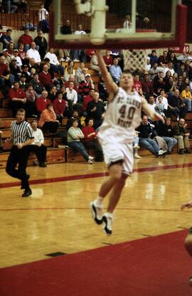 Jason Kron dunks a basketball during a basketball game against the University of North Dakota, St. Cloud State University