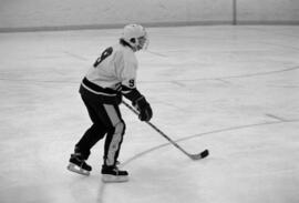 St. Cloud State hockey player Bob Motzko watches the puck during a men's hockey game against Bemidji State University