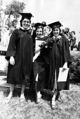 Three women celebrate after commencement, St. Cloud State University