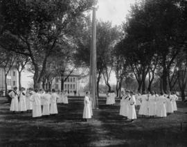 Female students gather and march around a May Pole, St. Cloud State University