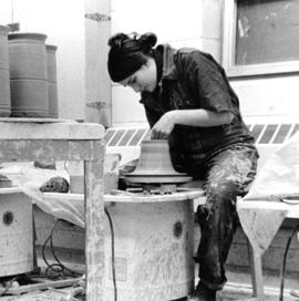 Student creates pottery, St. Cloud State University