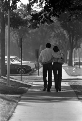 Man and woman walk together, St. Cloud State University