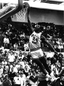 A basketball player dunks the basketball, St. Cloud State University