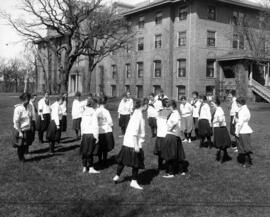 Women exercise near Lawrence Hall (1905), St. Cloud State University