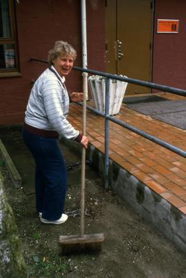 Woman sweeps, Aalborg, Denmark