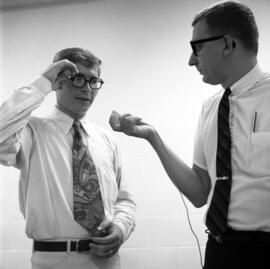 John Denver of the Mitchell Trio is interviewed by WJON's Mike Diem before their concert at Halenbeck Hall, St. Cloud State University
