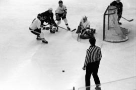 St. Cloud State hockey player Steve Martinson tries to score during a game with St. John's University