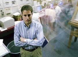 Editor Mike Koehler stands in the Chronicle newsroom, St. Cloud State University