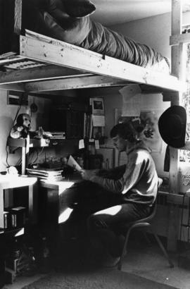 Student studies at his desk, St. Cloud State University