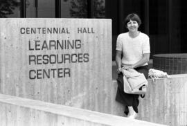 Rosie Muran sits outside of Centennial Hall (1971), St. Cloud State University