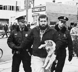 Doug Erickson is led away by police during a protest against the Vietnam War at the Stearns County Courthouse