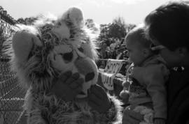 Husky mascot greets a child, St. Cloud State University