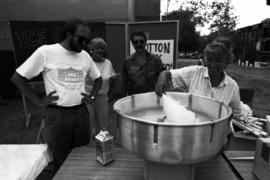 A woman makes cotton candy, Lemonade Concert and Art Fair, St. Cloud State University