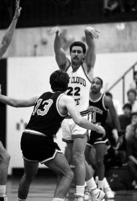 Bill Petersen looks to pass the basketball in a game against the University of Northern Colorado, St. Cloud State University