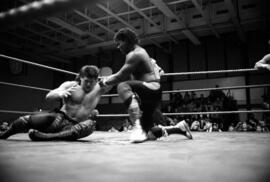 Derrick Dukes grabs the arm of Paul Diamond during a match at the Sauk Rapids High School