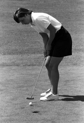 Anne Abicht putts a golf ball at the SCSU Women's Athletics Golf Classic fundraiser, St. Cloud State University