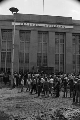 Protestors gather at a building, Day of Peace protest, St. Cloud State University