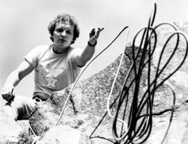 Carlo Schwinn throws down a rope on a rock climbing trip to Taylors Falls State Park, St. Cloud State University