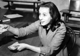 Woman collects money for the Chronicle, St. Cloud State University