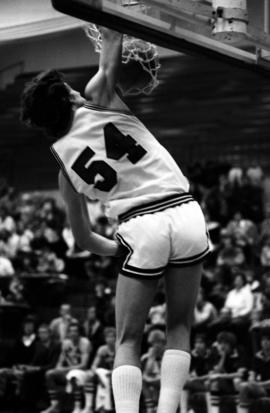 St. Cloud State University basketball player Dan Hagen dunks a basketball during a game