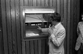 John Childs demonstrates Anytime Teller bank machine, Atwood Memorial Center (1966), St. Cloud State University