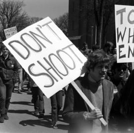 Vietnam war protestors march past Stewart Hall (1948), St. Cloud State University