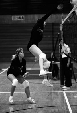 Volleyball player Becky Stream and another get ready to hit a volleyball during a match, St. Cloud State University