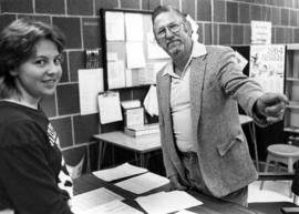 Reference librarian Norman Clarke helps a student, St. Cloud State University