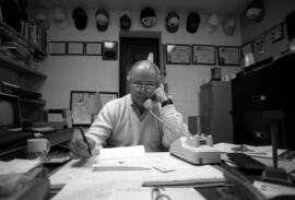 Bob Waxlax talks on the telephone, St. Cloud State University